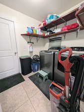 Washroom featuring separate washer and dryer
