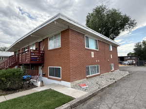 View of side of home featuring brick siding