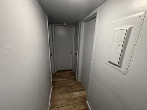 Hallway with wood tiled floors