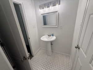Bathroom featuring baseboards
