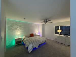 Bedroom featuring carpet flooring and a ceiling fan