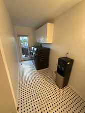 Laundry area with cabinet space and washing machine and clothes dryer
