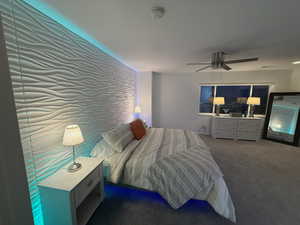 Bedroom with carpet and a ceiling fan