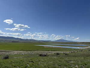 View of mountain background featuring a nearby body of water