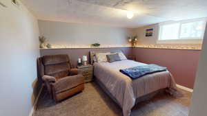 Bedroom with carpet and baseboards