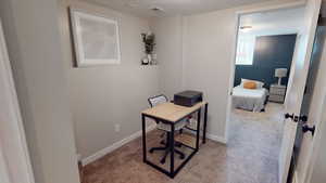 Office area featuring carpet flooring and baseboards