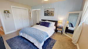 Bedroom featuring a closet and light carpet