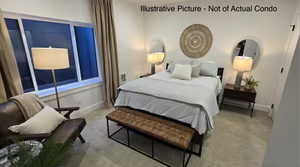 Carpeted bedroom featuring baseboards