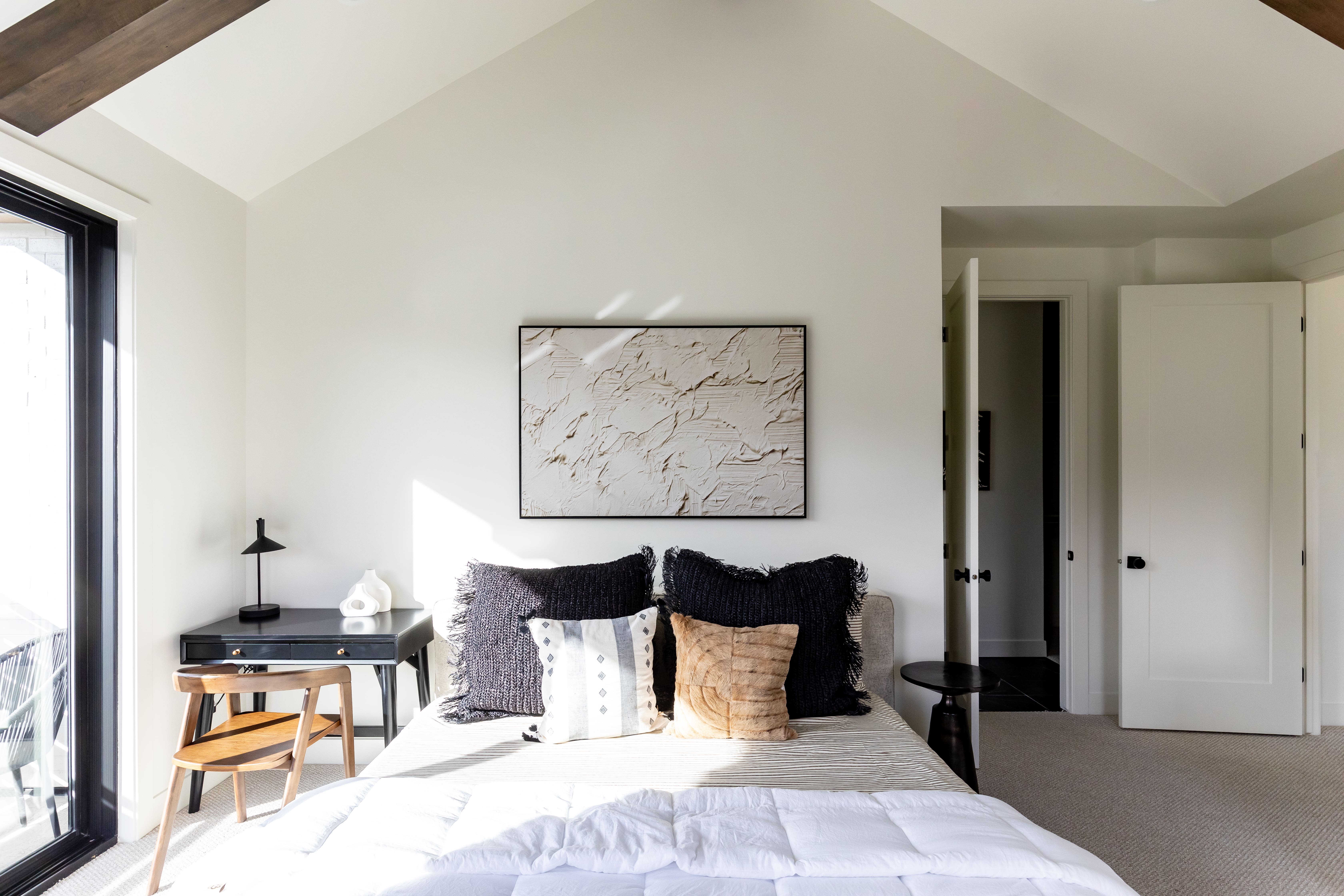 Carpeted bedroom with vaulted ceiling