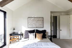 Carpeted bedroom with vaulted ceiling