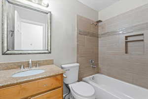 Bathroom featuring vanity and shower / washtub combination
