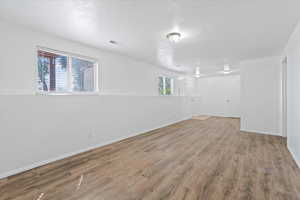 Below grade area featuring wood finished floors