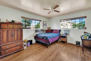 Bedroom featuring light wood-style flooring and ceiling fan