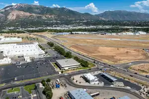 Aerial overview of property's location with a mountainous background