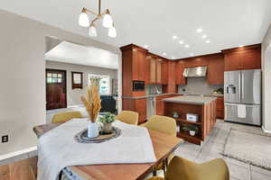 Dining area featuring a chandelier and recessed lighting