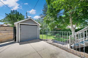 Detached garage featuring driveway