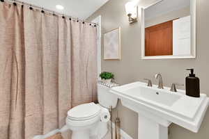 Full bath with curtained shower