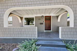 Doorway to property featuring a porch