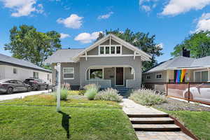 View of front of property featuring a front yard and a porch