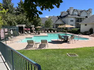 Community pool featuring a patio area