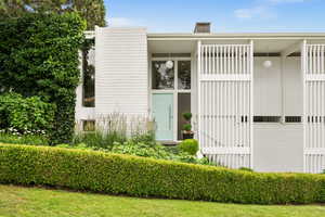 Property entrance with board and batten siding