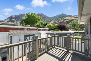 Wooden terrace with a mountain view and a storage shed
