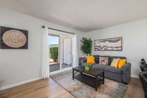 Living room with light wood finished floors and baseboards