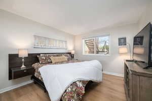 Bedroom featuring wood finished floors