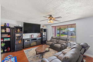 Living room featuring a ceiling fan
