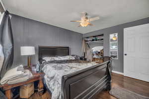 Bedroom featuring wood finished floors and a ceiling fan