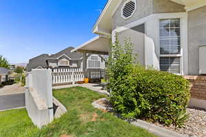 View of side of home with stucco siding