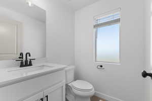 Bathroom with vanity and toilet