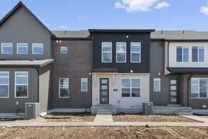 View of front of house featuring brick siding