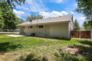 Back of property with a patio area, a shingled roof, crawl space, and french doors