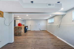 Basement featuring wood finished floors and recessed lighting