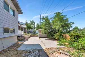 View of patio featuring a storage shed