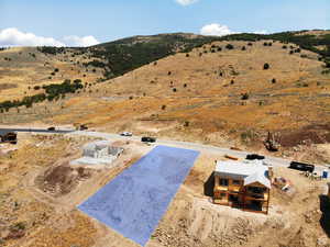 View from above of property with a mountainous background