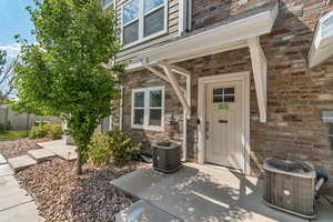 View of exterior entry with stone siding