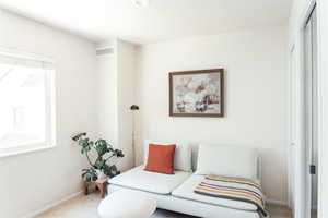 Living area with carpet floors