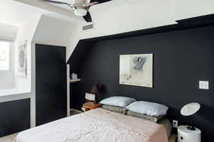 Bedroom with a ceiling fan