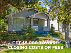 View of front of house with a porch and brick siding