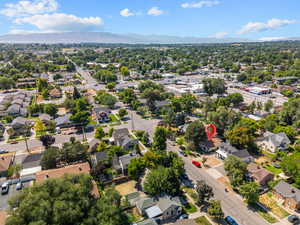 Aerial perspective of suburban area featuring a mountain backdrop