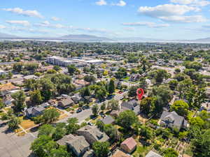 Aerial perspective of suburban area featuring a mountainous background