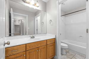 Bathroom featuring vanity and tub / shower combination