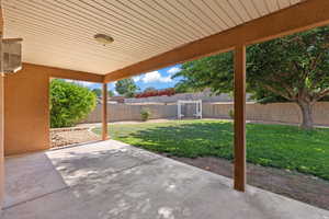 Fenced backyard featuring a patio