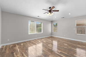 Spare room with recessed lighting, wood finished floors, and a ceiling fan