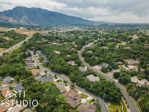 Aerial perspective of suburban area with a mountain backdrop