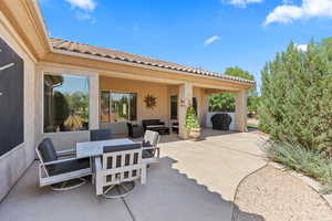 View of patio featuring an outdoor hangout area and outdoor dining space