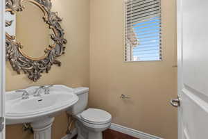 Bathroom with baseboards and toilet