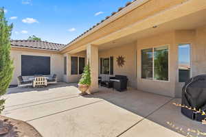 View of patio / terrace featuring a grill and outdoor dining area